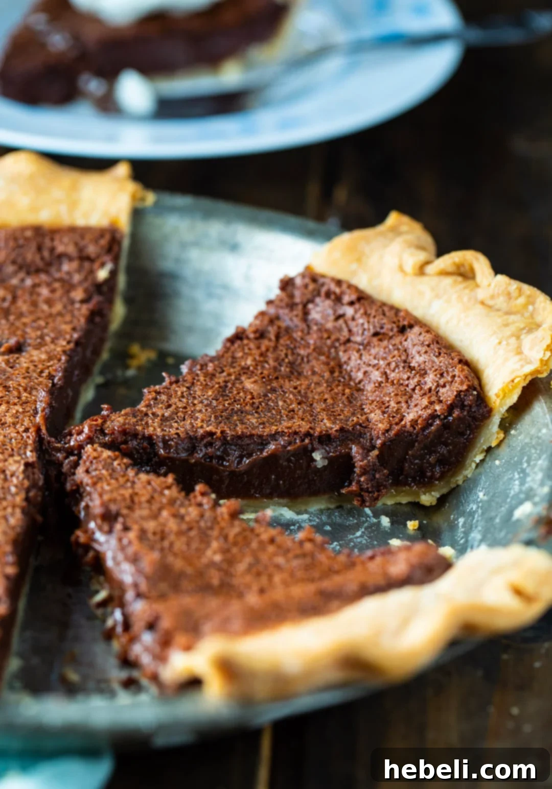Decadent Chocolate Chess Pie 4 A whole Chocolate Chess Pie cooling in a traditional metal pie tin, showcasing its appealing top crust.