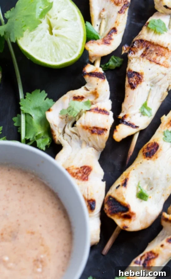 Creamy Almond Chicken Satay 4 Close-up of grilled Almond Butter Chicken Satay skewers on a plate, highlighting the char marks and delicious sauce