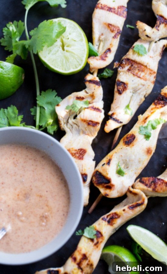 Creamy Almond Chicken Satay 5 Almond Butter Chicken Satay skewers served with a side of dipping sauce and fresh herbs