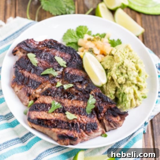 Juicy Grilled Margarita Rib-Eye Steaks, perfectly marinated in tequila, lime, and triple sec, ready to be served.