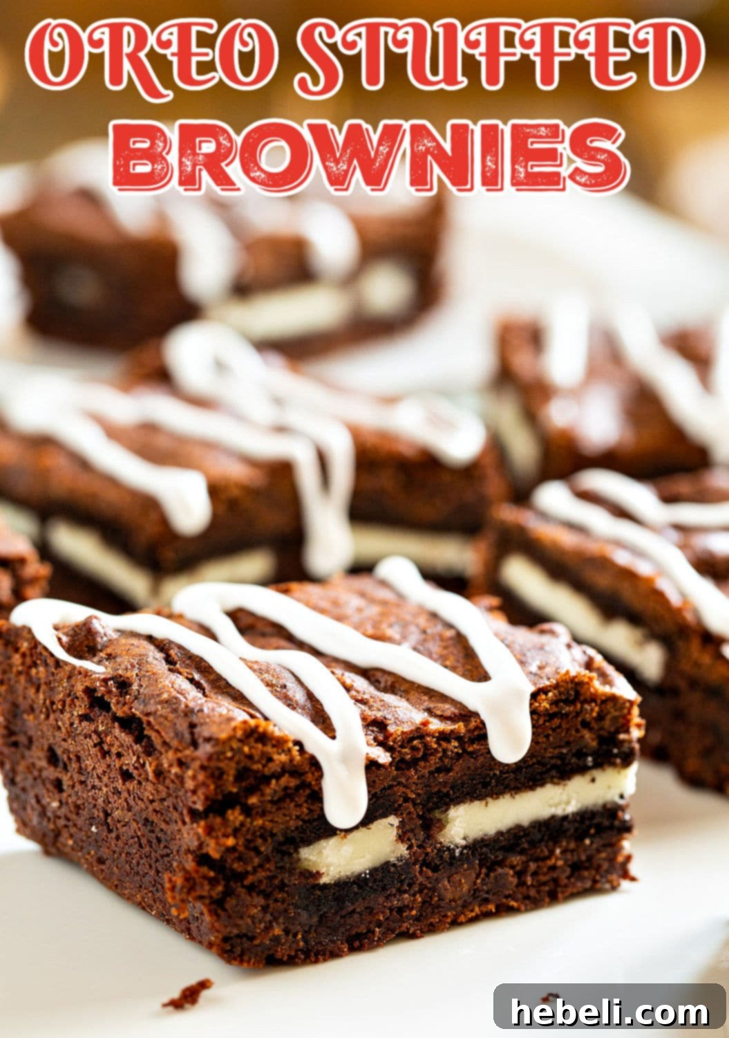 A serving of Oreo Stuffed Brownies, highlighting the beautiful white icing drizzle and rich chocolate base.
