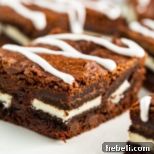 A delectable square of Oreo Stuffed Brownie, showcasing the thick chocolate and embedded Oreo.