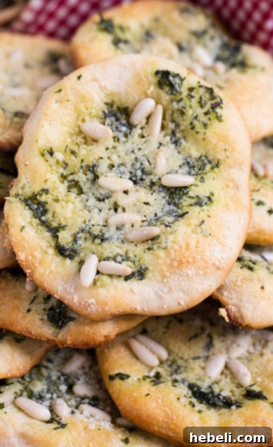 Mini Focaccia Bites 4 A tray of warm Biscuit Mini Focaccia just out of the oven, showing the beautiful texture and melted cheese. Ideal for an Italian meal.