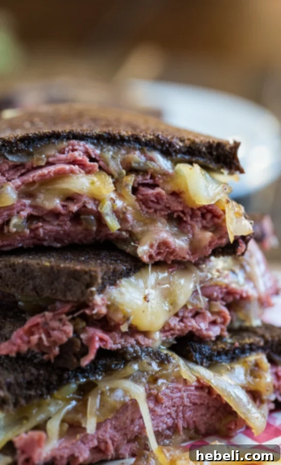 The Sizzling Corned Beef Melt 5 Close-up of a Corned Beef Grilled Cheese sandwich.