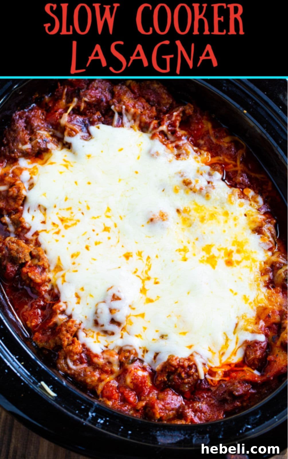Close-up of the delicious slow cooker lasagna bubbling and ready in the slow cooker.