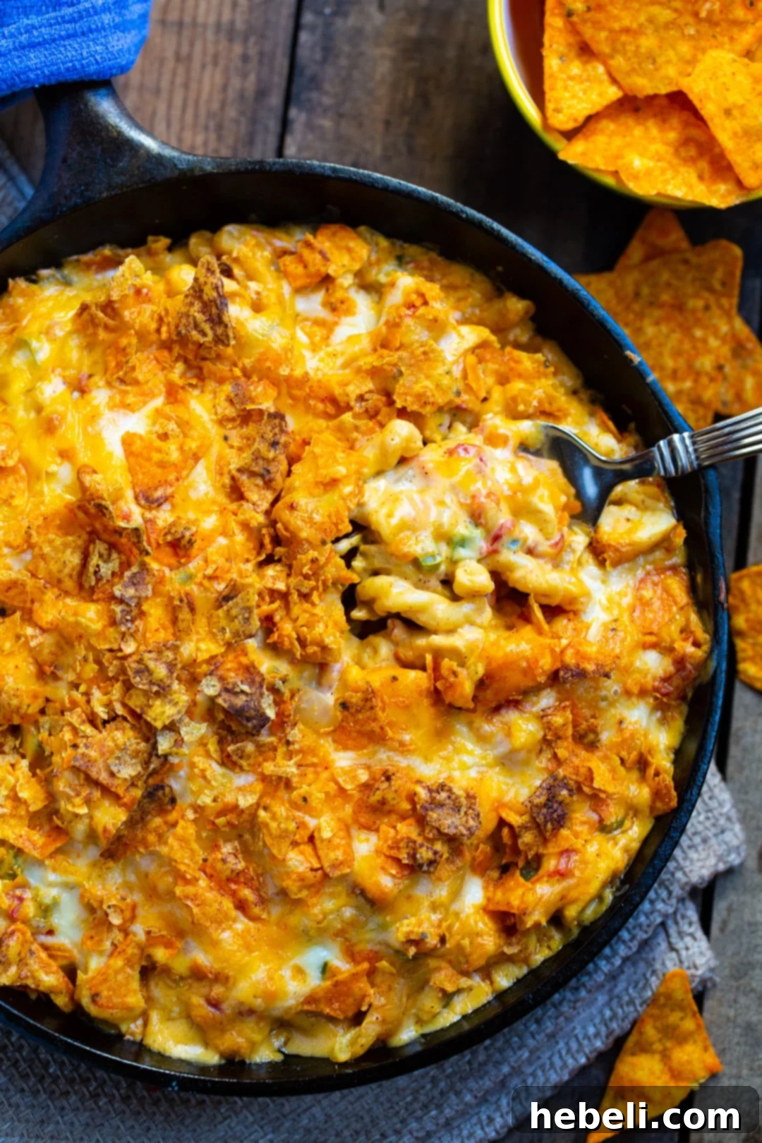 Hearty King Ranch Mac and Cheese 4 Overhead view of King Ranch Mac and Cheese in a cast iron pan, showing the golden crunchy Dorito topping.