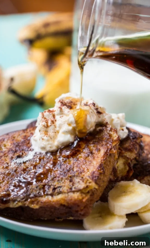 Another perspective of White Chocolate Banana Bread French Toast, showing its soft interior