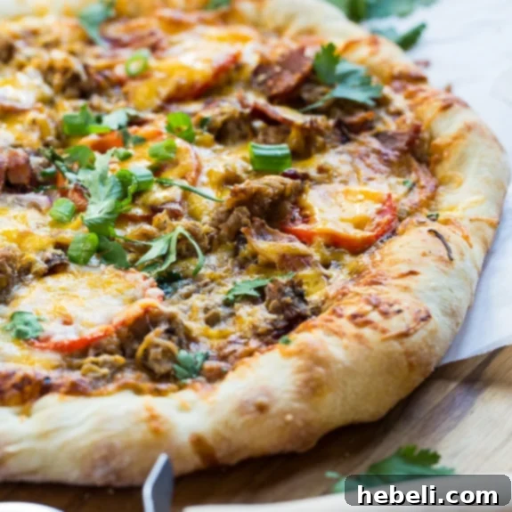 Delicious Southern BBQ Pizza with Pulled Pork, garnished with fresh herbs.