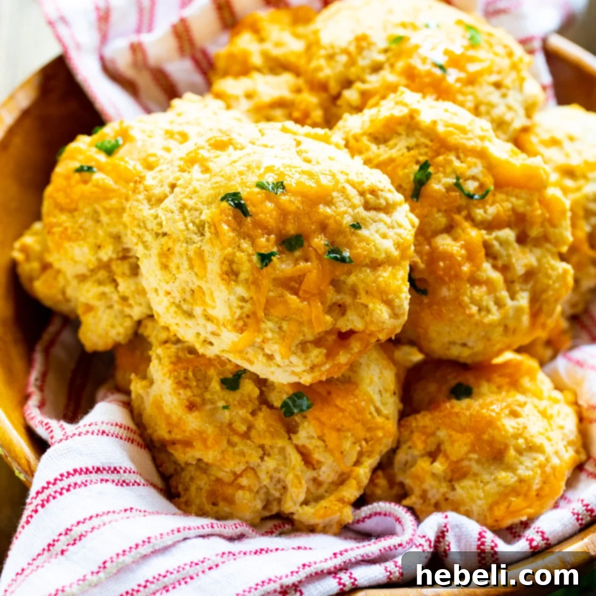 Irresistible Red Lobster Cheddar Bay Biscuits served warm in a rustic wooden bowl, ready to be enjoyed.