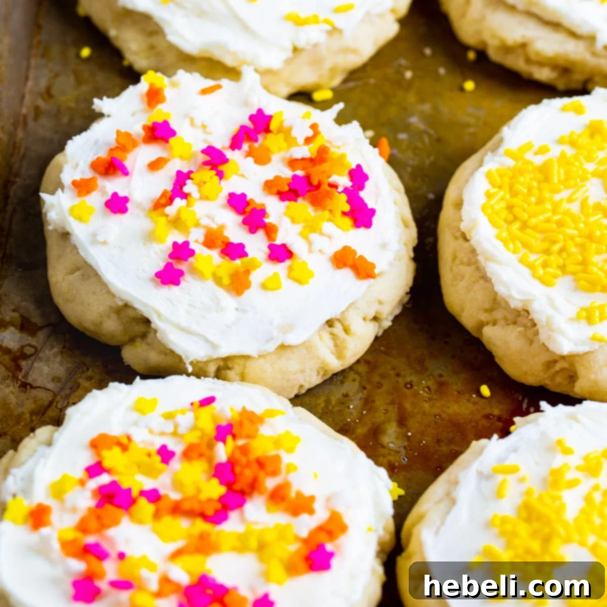 Lofthouse-Style Cookies covered in sprinkles on a baking sheet, ready to be enjoyed.