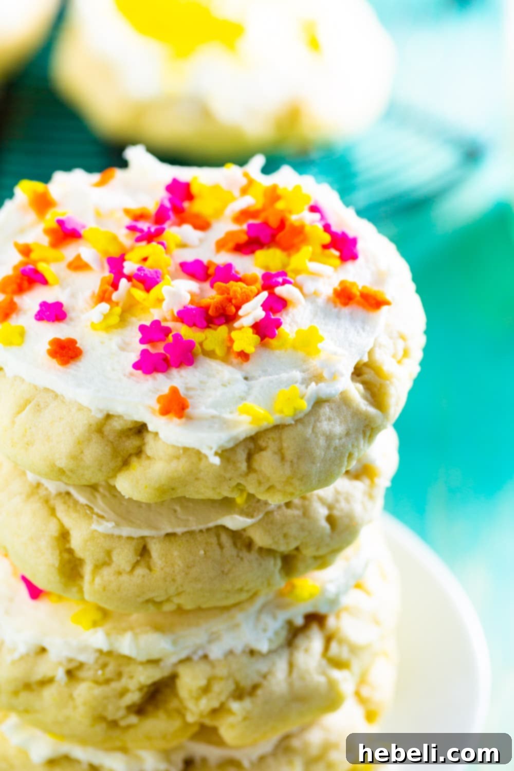 Stack of freshly baked Lofthouse Sugar Cookies on a plate, showcasing their soft texture.