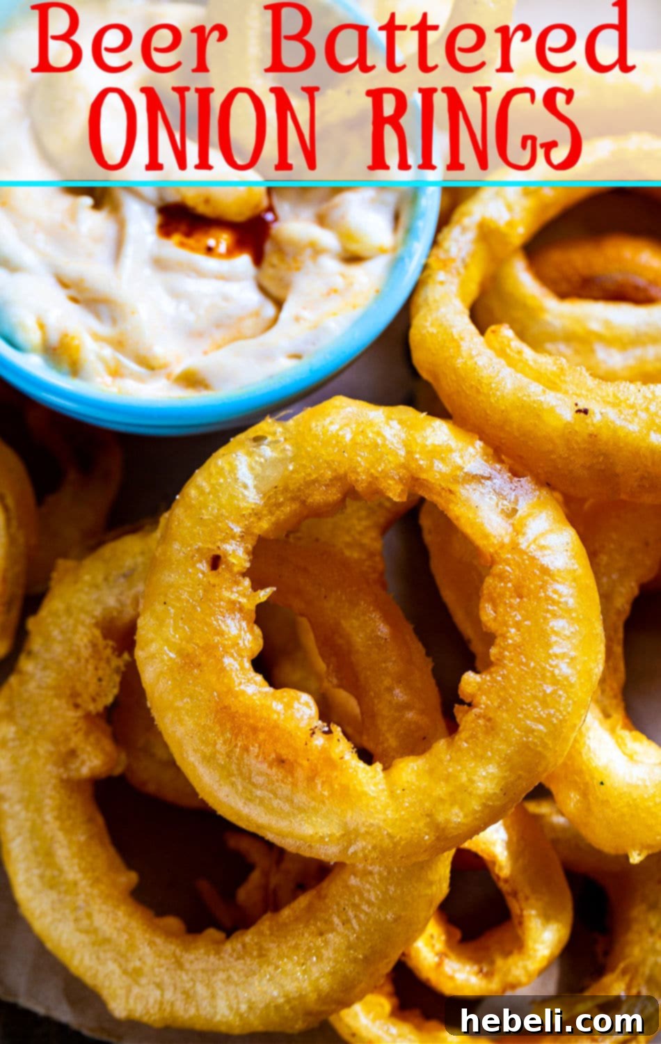 Perfectly Crispy Beer Onion Rings 4 Freshly fried Beer Battered Onion Rings with a rich, golden hue.