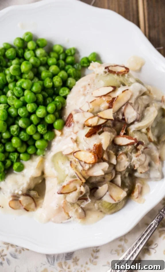 Creamy Chicken Artichoke Bake 4 Chicken Artichoke Casserole, a delightful spring casserole topped with perfectly toasted almonds, ready to serve.