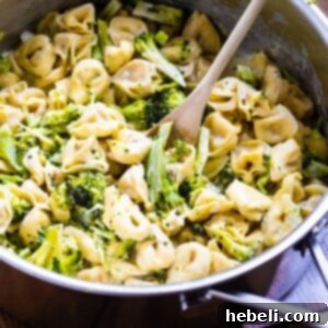 Broccoli Alfredo Tortellini in a large pot, ready for serving.