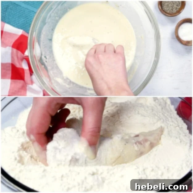 Dipping a chicken tender in batter, then rolling it in breadcrumbs for a double coating.
