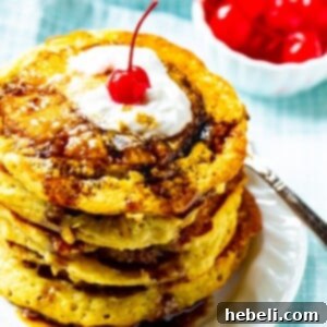 Stack of Pineapple Upside Down Pancakes on a plate.