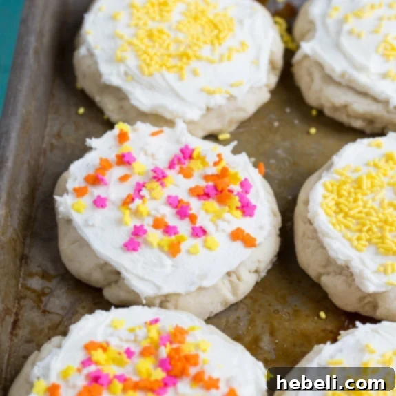 Soft and fluffy Lofthouse Style Cookies with pink frosting and sprinkles.