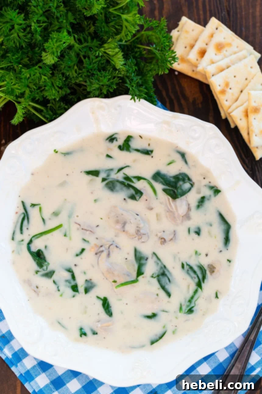 Oyster Stew: A Creamy Brie and Spinach Infusion 4 Bowl of Oyster Stew with Brie and Spinach, garnished with fresh parsley.