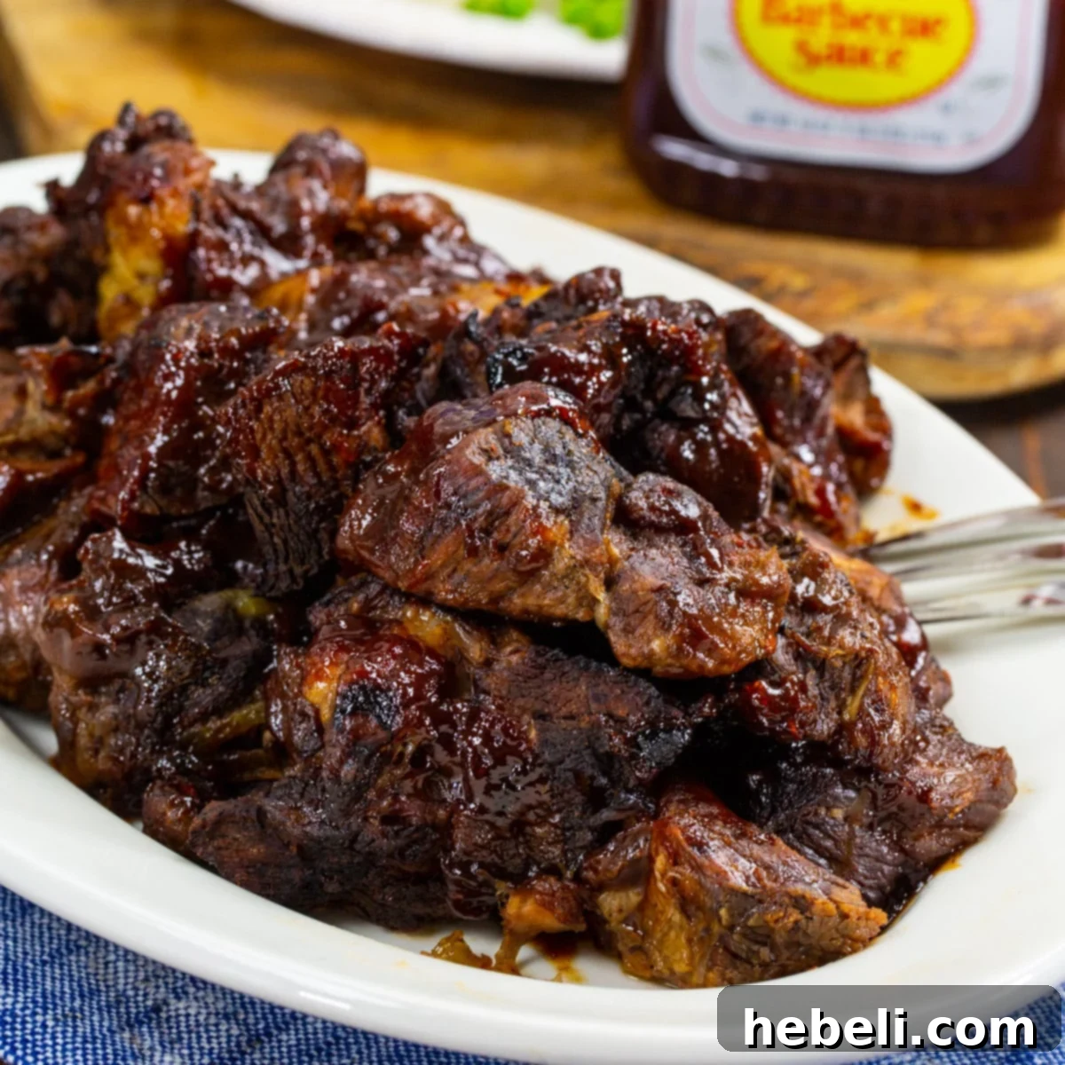 Slow-Cooker BBQ Beef 2 Delicious BBQ Crock Pot Roast served on a platter, ready to eat.