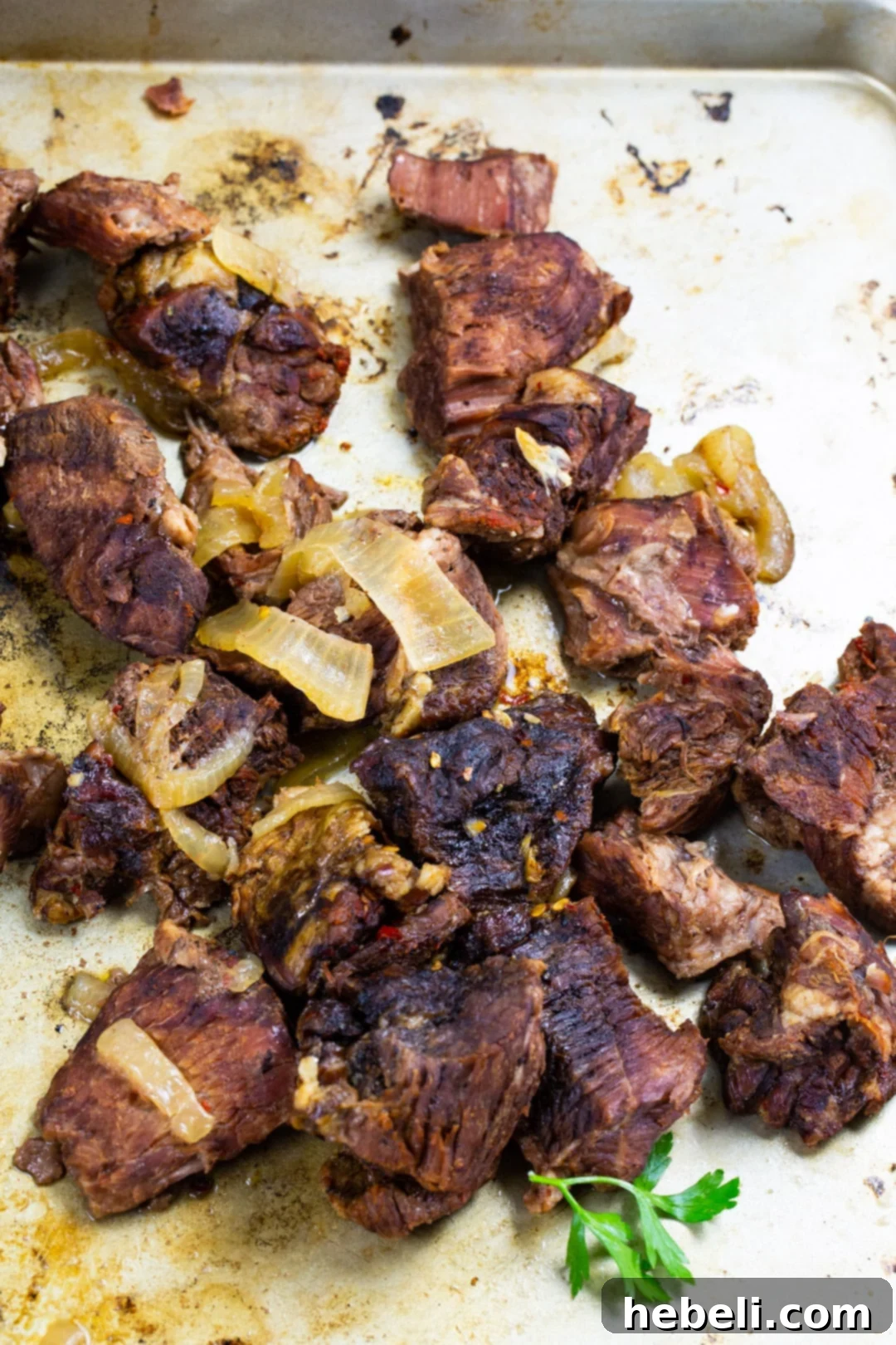 Slow-Cooker BBQ Beef 3 Chunks of slow-cooked beef, ready to be broiled for a caramelized finish.