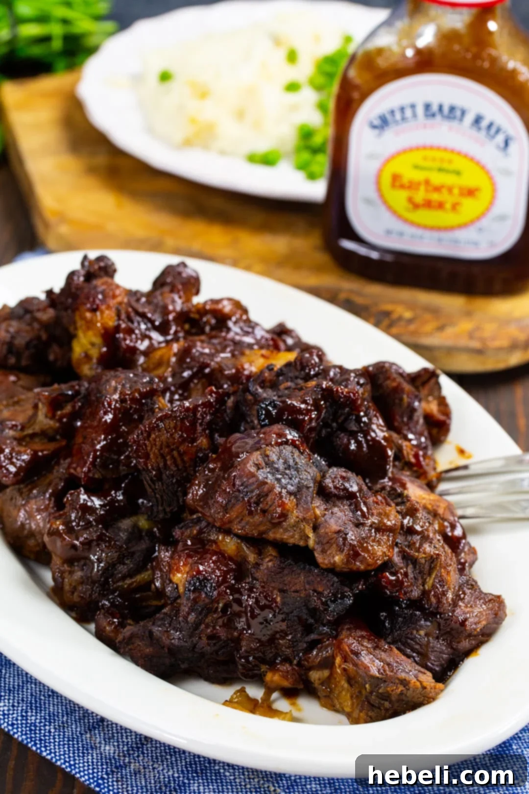 Slow-Cooker BBQ Beef 5 Beautifully plated BBQ Crock Pot Roast, ready to be served.