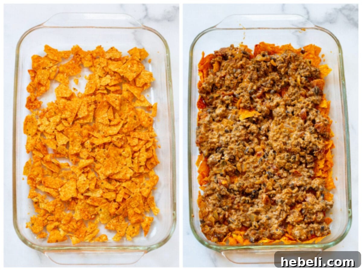 Casserole being layered into baking dish