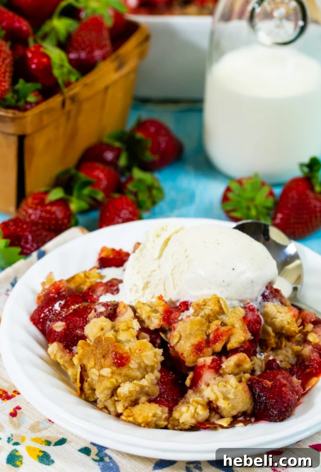 Rustic Strawberry Crumble 4 Strawberry Crisp topped with a generous scoop of melting vanilla ice cream.