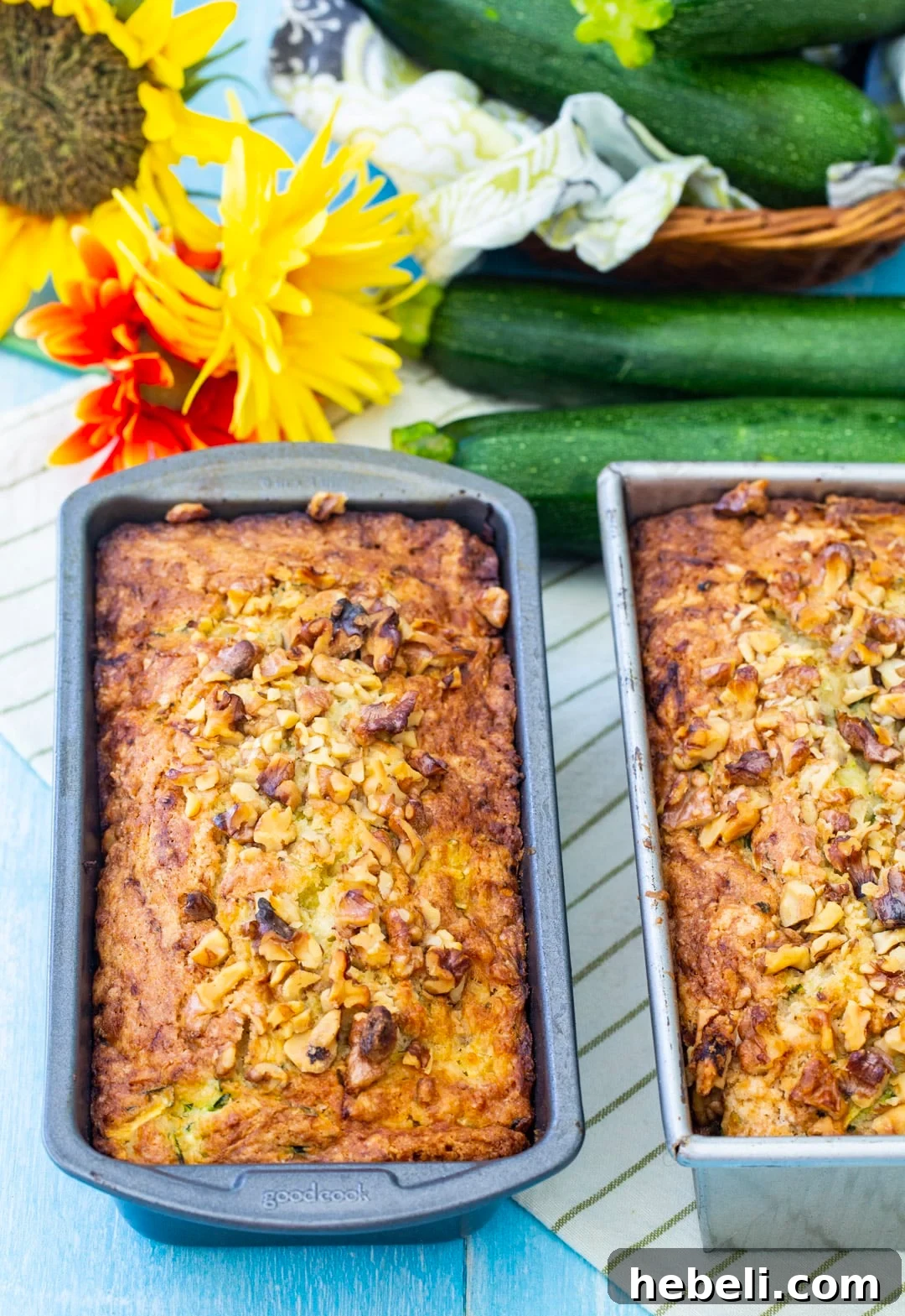 Pina Colada Zucchini Bread Recipe — Tropical Zucchini Loaf 3 Two Loaves of zucchini bread in baking pans.