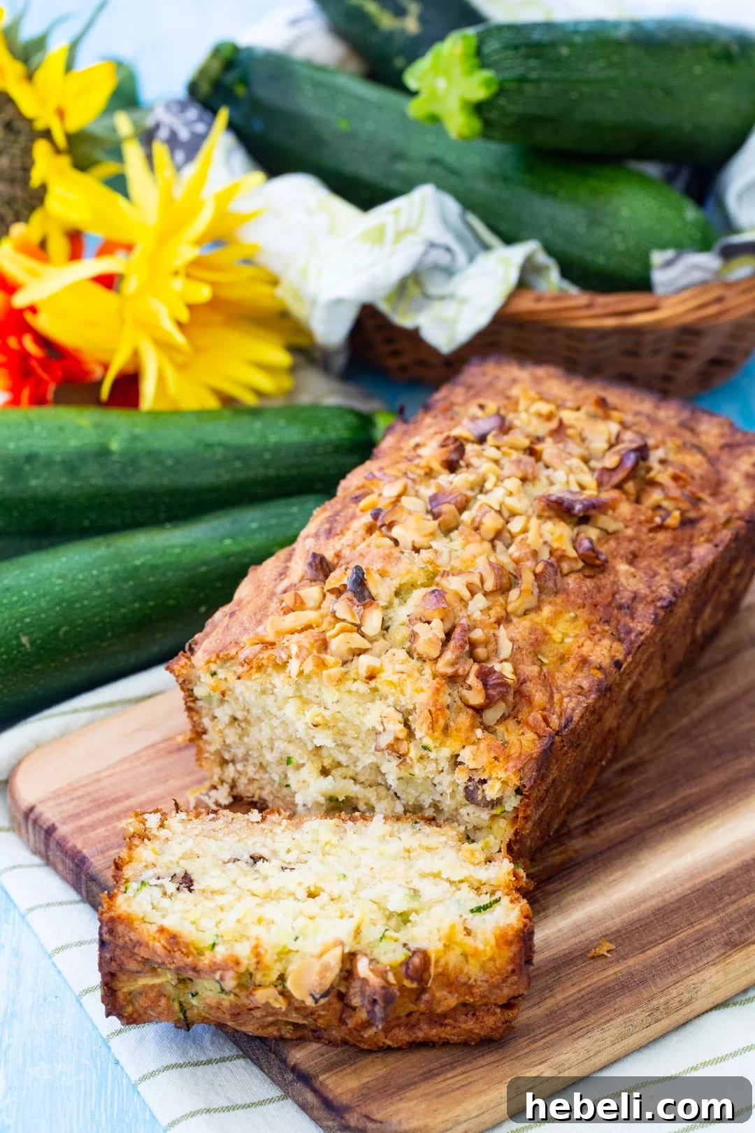 Pina Colada Zucchini Bread Recipe — Tropical Zucchini Loaf 4 Loaf of zucchini bread with a slice cut.