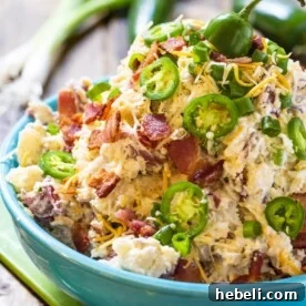 Jalapeno Popper Potato Salad in a blue serving bowl.