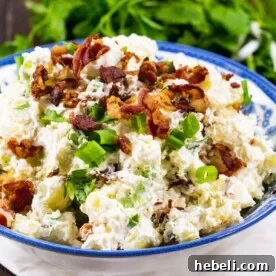 Sour Cream and Bacon Potato Salad in a blue and white bowl.