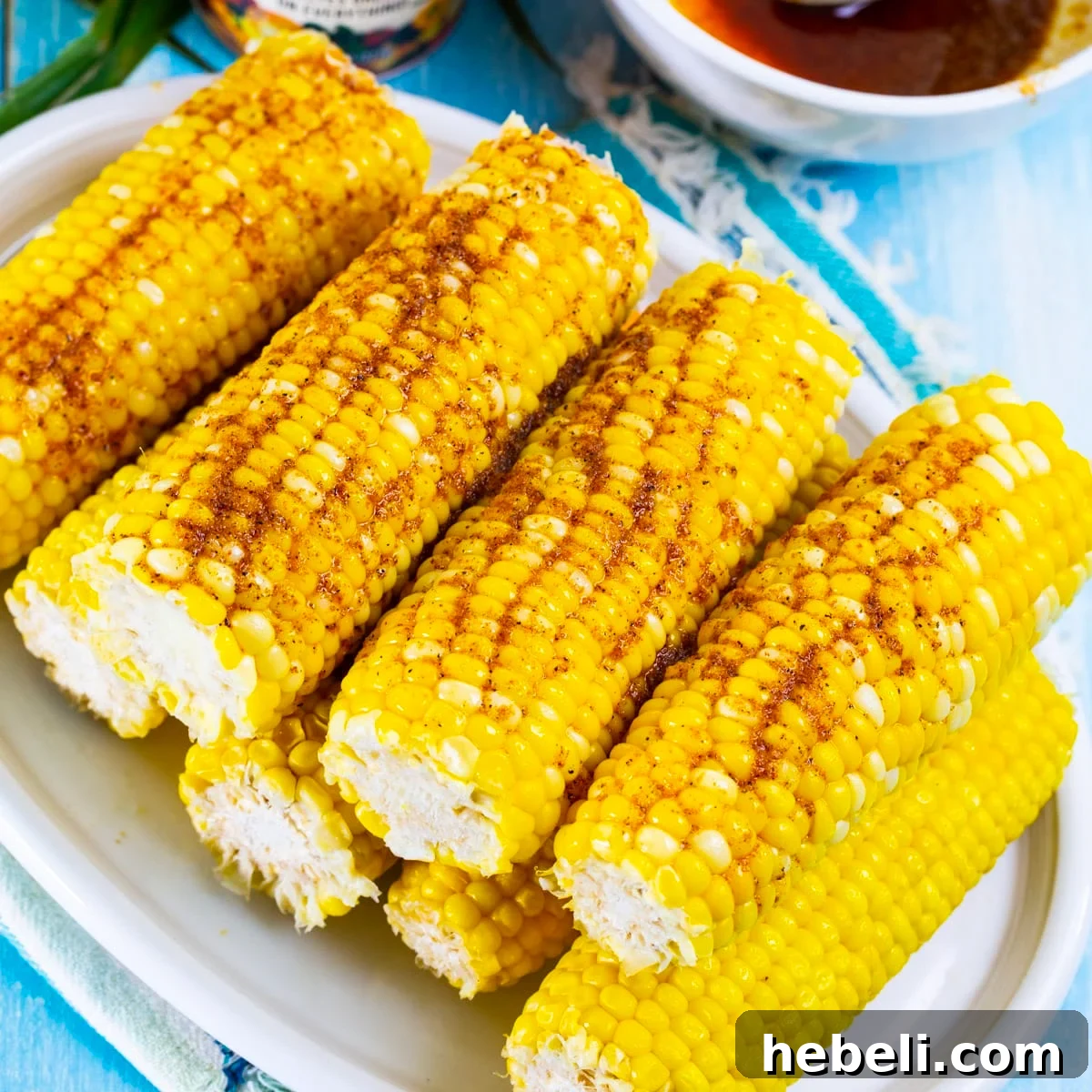 Spicy Cajun Buttered Corn Recipe 2 Cajun Buttered Corn on a serving plate.