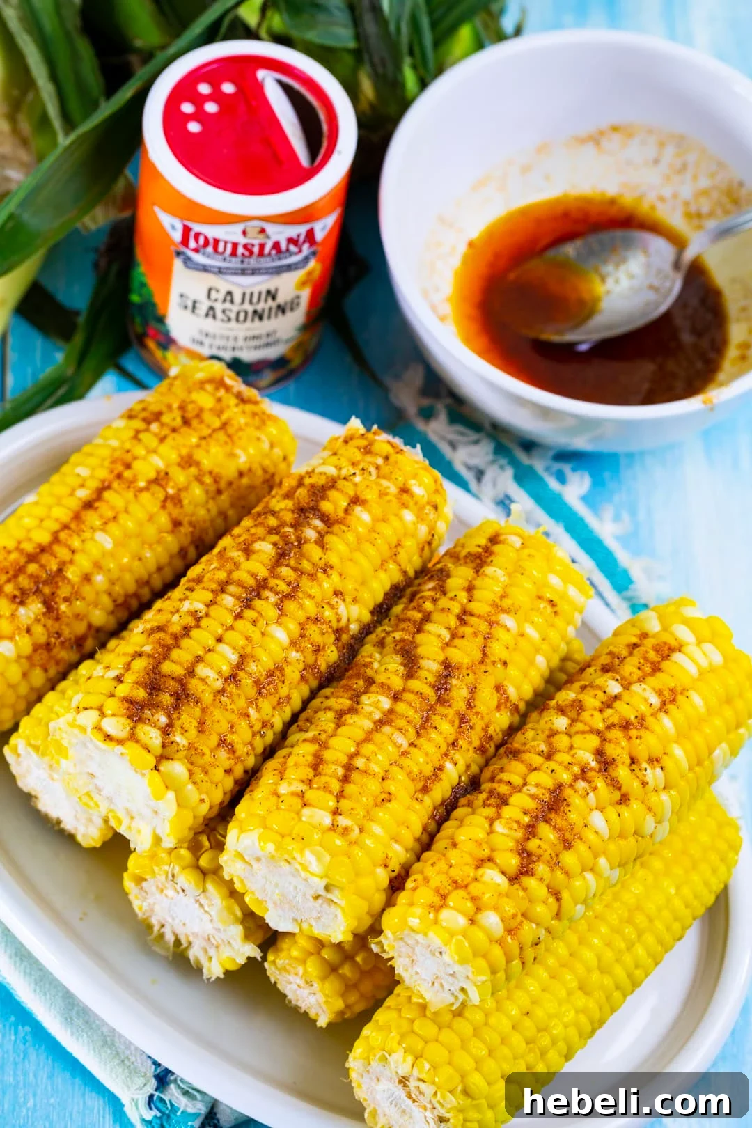 Spicy Cajun Buttered Corn Recipe 3 Corn on the cob covered with cajun butter.
