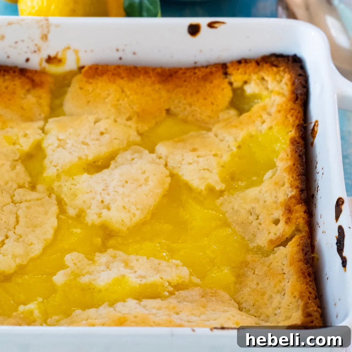 Warm Lemon Cobbler with Buttery Crust 2 Lemon Cobbler in a square baking dish.