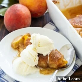 Peach Dumpling on a plate with vanilla ice cream