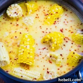 Fresh Corn Recipes to Try Before Summer Ends 6 Southern Hot Honey Butter Corn in a pot.