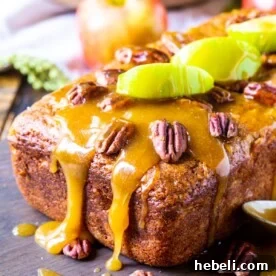 Caramel Apple Bread topped with apple slices and pecans.