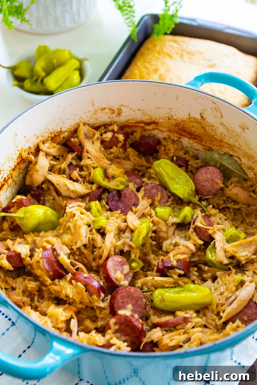 Chicken Bog with Pepperoncini Peppers in a Dutch oven.